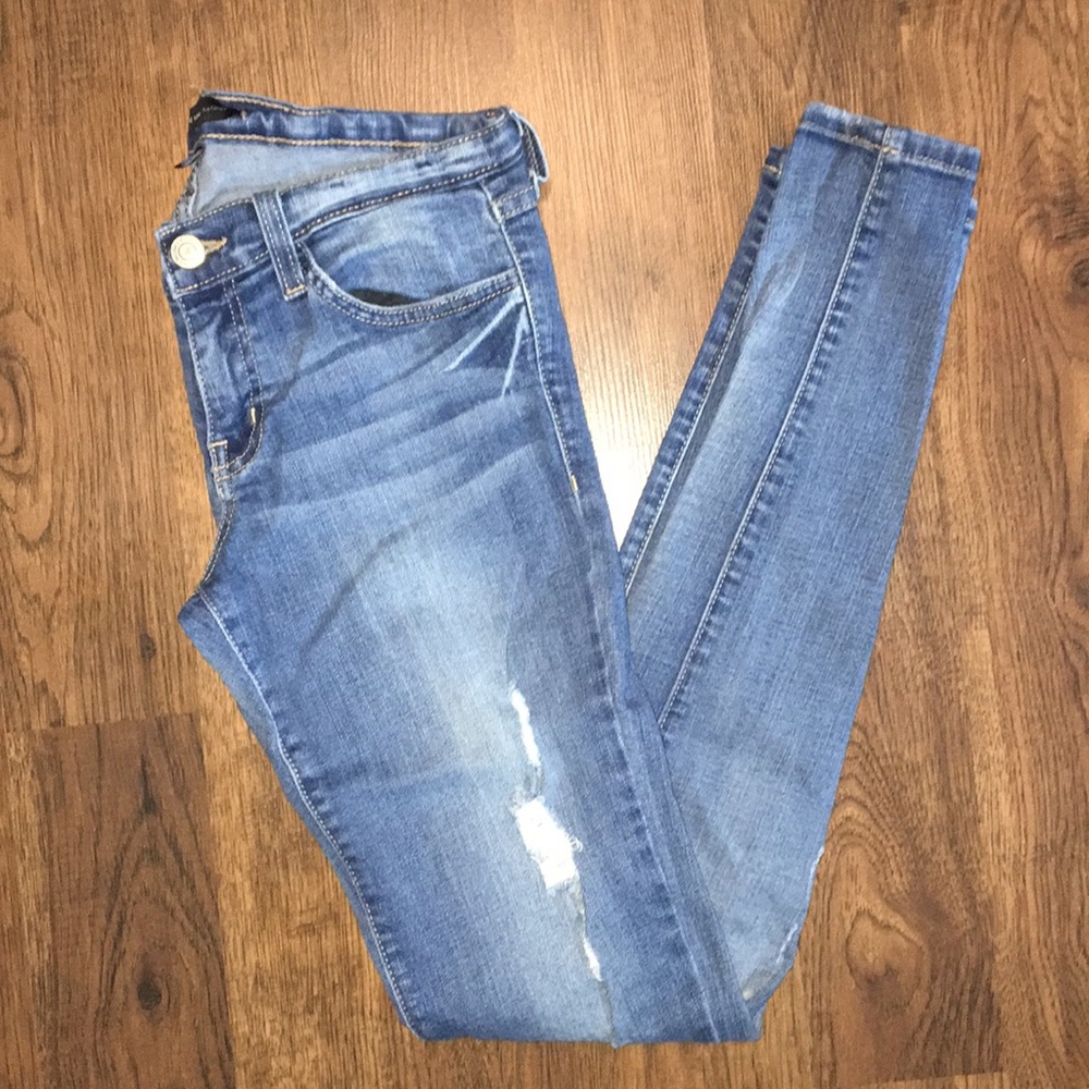 Distressed flying monkey skinny jeans